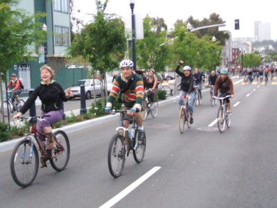 Critical Mass bikers Coralie and Malcolm on Octavia Boulevard.
